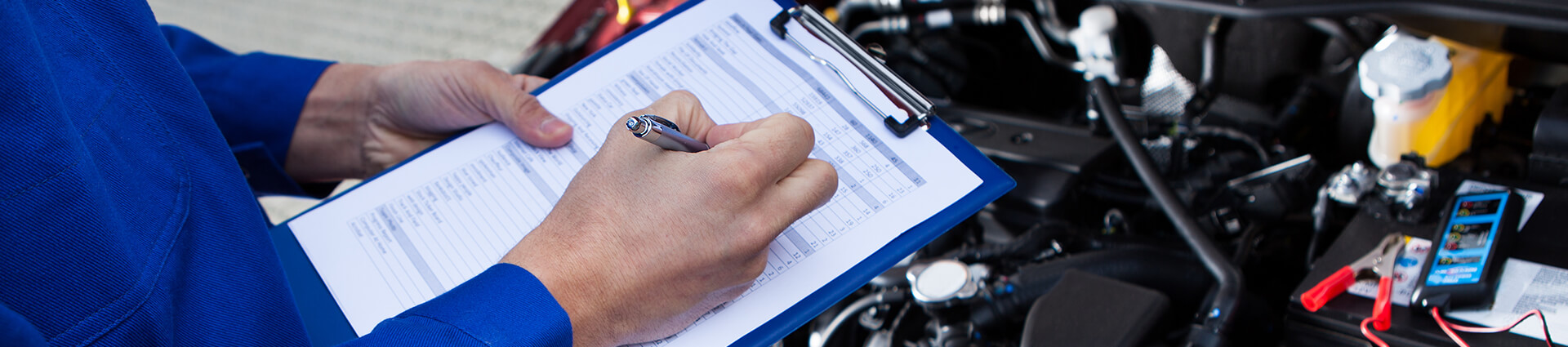 mechanic holding clipboard