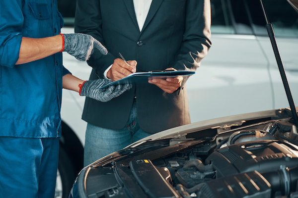 Mechanic showing auto repair services