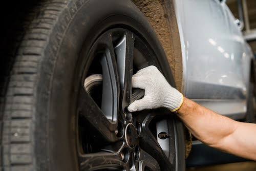 Las Vegas mechanic installing a new tire