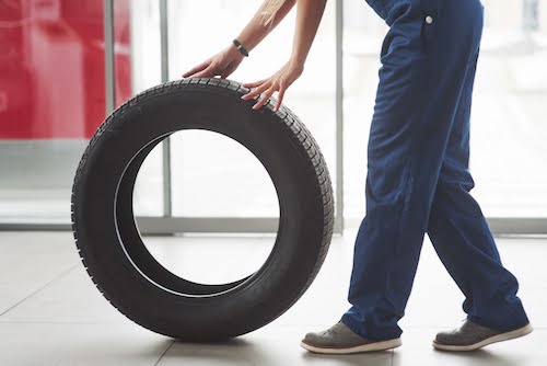 Las Vegas mechanic moving a car tire