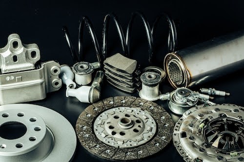 a variety of car parts on a black background